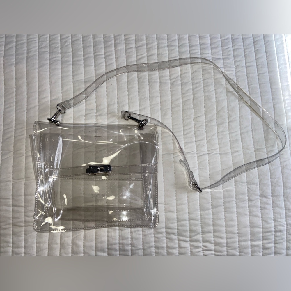 Clear multi-pocket purse with detachable & adjustable straps.